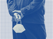 Blue-tinted editorial photo illustration of a person holding a KN95 face mask behind their back against a grid background.