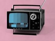 Vintage Sony portable television with antenna displaying a pixelated blue static screen, set against a pink background.