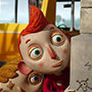 Illustrated puppet or animated character with red hair and wide eyes, appearing to be from an animated film or editorial art.