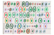 Hand-drawn illustration featuring rows of colorful oval and circular eye-like shapes in various sizes and color combinations on a white background.