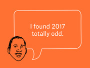 Editorial illustration on an orange background showing a sketched face with a speech bubble reading 'I found 2017 totally odd.'