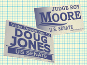 Two campaign yard signs for the Alabama US Senate race featuring Judge Roy Moore and Doug Jones against a grid background.
