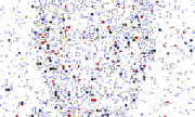 A dense collage of scattered blue text fragments, colored rectangles, and small images creating an abstract mosaic pattern across the entire frame.
