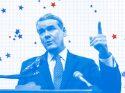 Blue-tinted editorial illustration of a male politician speaking at a podium with microphones, set against a grid background with red and blue stars.