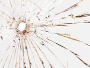 Editorial illustration of shattered glass with a bullet hole, overlaid with fragments of a map or chart visible through the cracks.