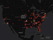 Dark-themed map of the United States and surrounding regions showing numerous red location pin markers clustered across major cities.