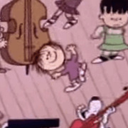 Cartoon still from Peanuts showing characters dancing and playing instruments including a double bass and guitar.