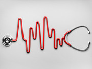 A stethoscope whose red tubing forms the shape of a heartbeat EKG waveform against a gray background.