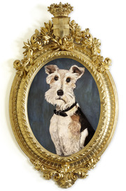 Painted portrait of a terrier dog with a black collar displayed in an ornate oval gold frame topped with a crown and crest.