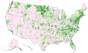 Choropleth map of the United States showing geographic variation using shades of green and pink, likely representing some demographic or political metric at the county or census-tract level.