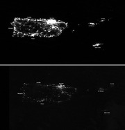Two satellite nighttime light images of Puerto Rico and nearby islands comparing before and after Hurricane Maria, showing dramatic reduction in artificial light.