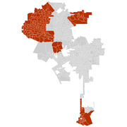 A map of what appears to be the Los Angeles area showing census tracts or precincts, with certain areas highlighted in dark red against a gray background.
