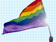 A rainbow Pride flag being waved by a hand, shown against a blue grid background in FiveThirtyEight's editorial illustration style.