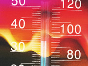 Close-up editorial illustration of a thermometer with Celsius and Fahrenheit scales against a vivid red and orange heat-themed background.
