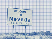 Blue-tinted editorial illustration of a Welcome to Nevada The Silver State road sign against a grid-paper background with desert landscape.