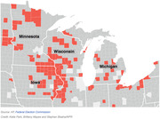 County-level map of the upper Midwest showing Minnesota, Wisconsin, Iowa, and Michigan with certain counties highlighted in red.