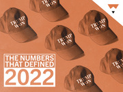 Editorial illustration showing multiple Trump Won baseball caps on an orange background with the title The Numbers That Defined 2022.