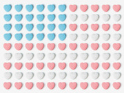 Grid of candy hearts in blue, pink, and white arranged in rows on a white background, resembling a decorative Valentine's Day pattern.