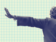 Duotone editorial photo illustration of a person with outstretched arm and raised hand against a blue grid background.