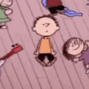 Animated cartoon scene showing Peanuts characters including Charlie Brown dancing on a wooden floor.