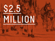 Red-tinted photo of sled dogs overlaid with large white text reading $2.5 Million, likely referencing a prize or budget figure.