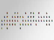 An arrangement of colorful pharmaceutical capsule pills spread across a light gray background in a loose grid pattern.