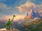 Animated scene from The Good Dinosaur showing a green cartoon dinosaur with a small human child on its back standing on a cliff overlooking a mountain valley.