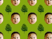 Repeating pattern of baby faces and green trees on a lime green background, used as decorative editorial art.