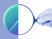 Editorial illustration showing a hand holding a magnifying glass over a large pill or tablet, rendered in blue and teal tones.