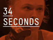 Red-tinted editorial graphic overlaying a UFC fighter's face with large text reading 34 seconds, communicating a notable fight duration.
