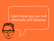 Orange editorial illustration of a cartoon man with glasses and a speech bubble reading 'I don't think you can troll effectively with Delaney.'