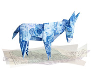 An origami donkey folded from US currency bills featuring Alexander Hamilton, standing on a faded map, symbolizing Democratic Party campaign finance.