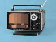 Vintage Sony portable television with a pixelated censored image on its screen, set against a blue background.