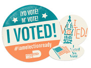 Three I Voted stickers including a large Miami-Dade County bilingual sticker, a Philadelphia city hall sticker, and a small bilingual oval sticker.