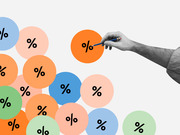 Editorial illustration of a hand holding a pencil pointing at colorful circles each containing a percent sign, representing interest rates or statistics.