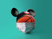 A basketball wearing Mickey Mouse ears and a surgical face mask, symbolizing the NBA bubble at Walt Disney World during the COVID-19 pandemic.