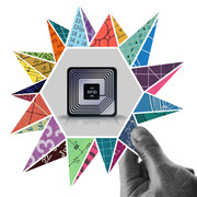 Editorial illustration showing an RFID chip in a hexagon surrounded by colorful triangular fragments with math and circuit patterns, with a hand pointing at it.