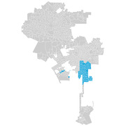 A census tract map of a large city showing a cluster of blue-highlighted tracts in the southeastern area against a gray background of all other tracts.