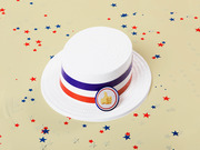 Illustrated white boater hat with red, white, and blue ribbon and a thumbs-up emoji pin, surrounded by patriotic star confetti on a beige background.