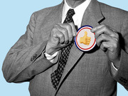 Black and white photo collage of a suited man pinning a red-white-and-blue campaign button featuring a thumbs-up emoji onto his lapel.