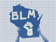 Editorial illustration showing hands holding a BLM protest sign shaped like Wisconsin, with a raised fist symbol, on a grid background.