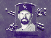 Editorial illustration of a bearded baseball player wearing a Colorado Rockies cap, framed in a Hall of Fame plaque style with crossed bats, baseballs, and laurel decorations.