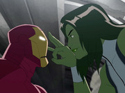 Animated cartoon scene showing Iron Man and She-Hulk facing each other, with She-Hulk holding up two fingers near Iron Man's helmet.