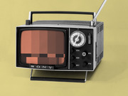 Vintage Sony portable television with antenna showing a pixelated static screen, photographed against a yellow-green background as editorial illustration.