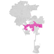 Map of Los Angeles area census tracts with a cluster of highlighted pink tracts in the central-south region against a gray background.