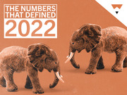 Editorial illustration showing two elephant figurines facing each other on an orange background with the headline The Numbers That Defined 2022.