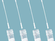 Four COVID-19 nasal swab test kits with swabs and collection vials arranged in a row against a teal background.