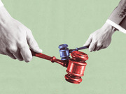 Editorial illustration showing two hands from opposite sides fighting over a gavel colored in red and blue, symbolizing partisan conflict over the judiciary.
