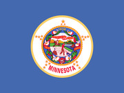 The state flag of Minnesota featuring the state seal on a blue background with the word MINNESOTA and dates 1858, 1819, and 1893.