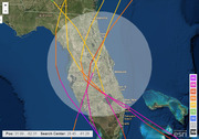 Satellite map of Florida showing multiple hurricane track forecast paths in various colors converging over the state, with a cone of uncertainty circle and storm intensity legend.